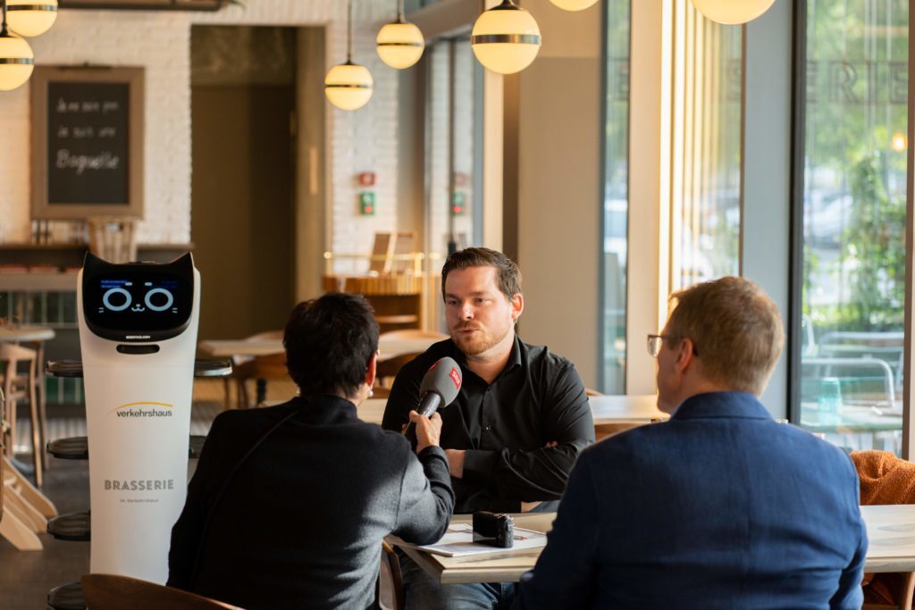 SRF interview about the BellaBot in the brasserie in the Swiss Museum of Transport with service staff